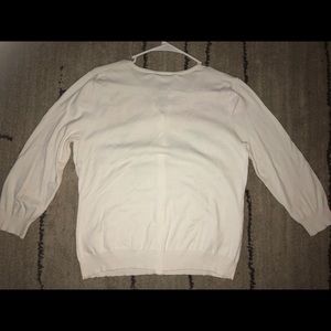 White cardigan sweater with floral front accents